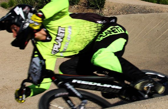 BMX racer on Redline bike showcasing Planett Active Range with Josh Callan for BMX Victoria State