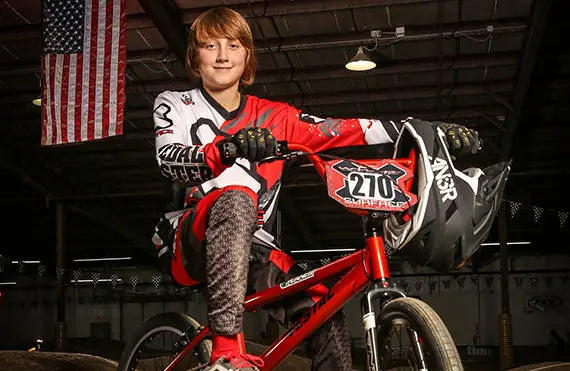 BMX rider on a red bike representing Planett Active Range with USA Rider Damen as local rider ambassador