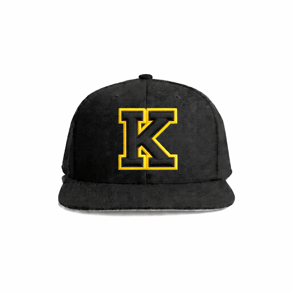 Black suede snapback cap featuring a bold yellow embroidered ’k’ logo.