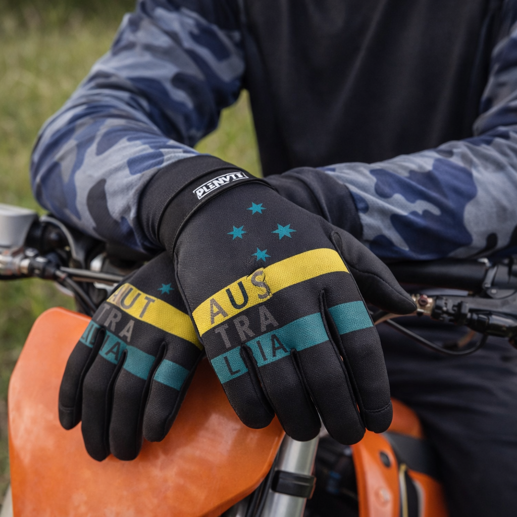 Black motorcycle gloves with yellow and teal stripes, featuring ’australia’ text and star motifs.
