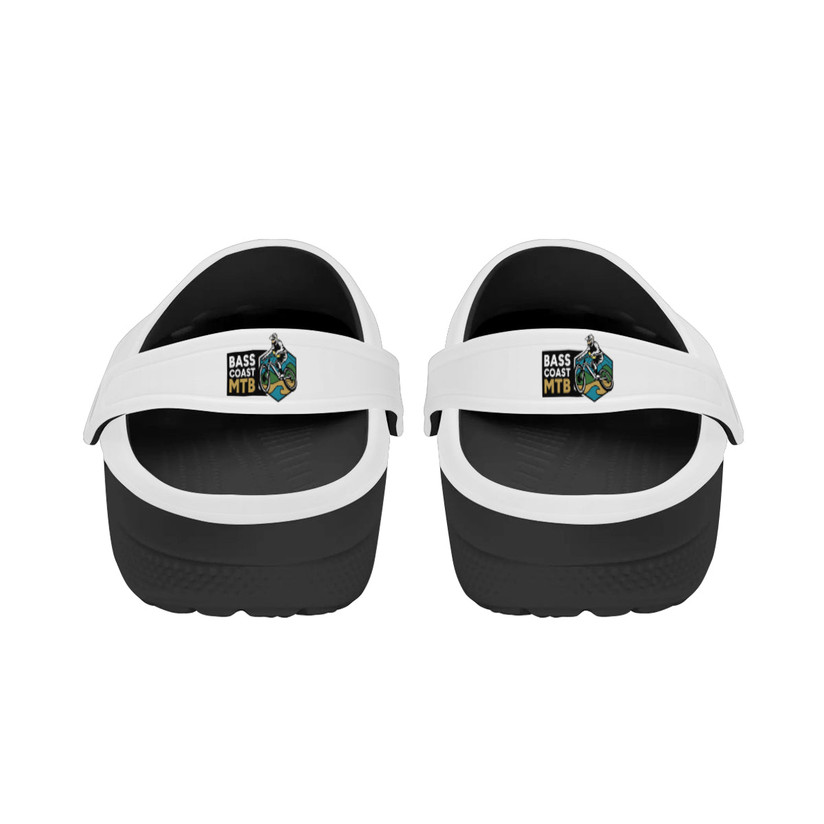 Pair of white and black slip-on sandals.
