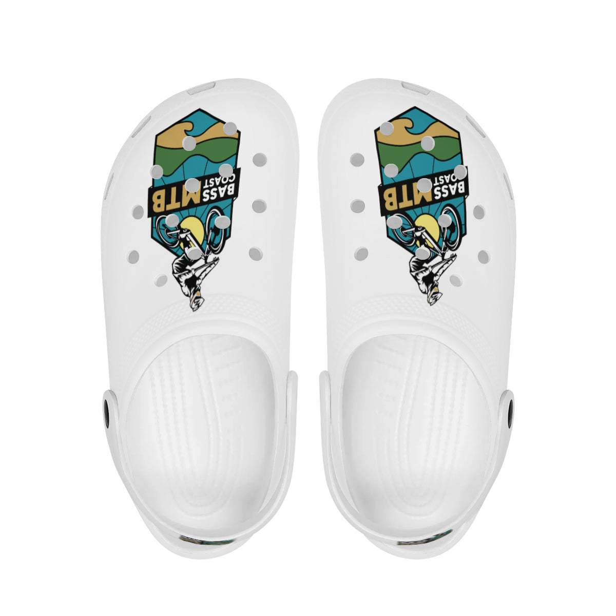 A pair of white Crocs with a colorful graphic design featuring a mountain biker.