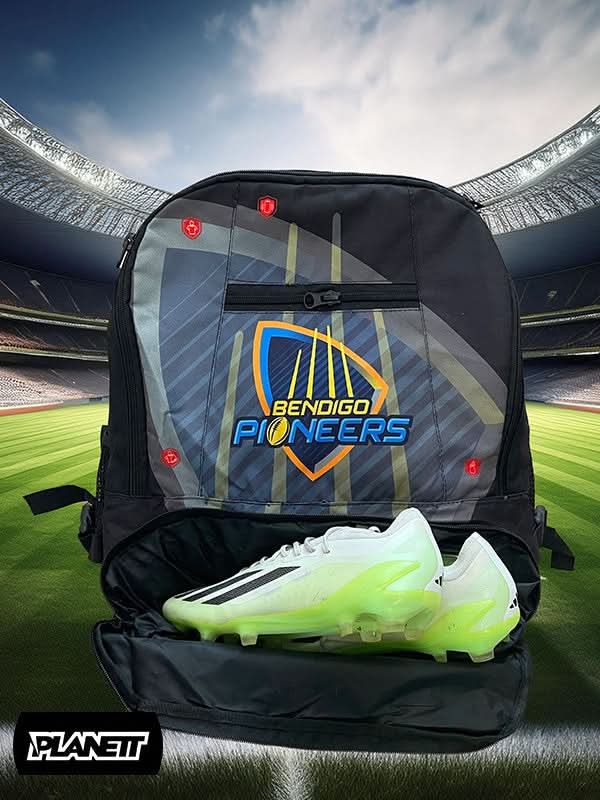 Black and gray sports backpack with a dedicated compartment for lime green and white cleats.