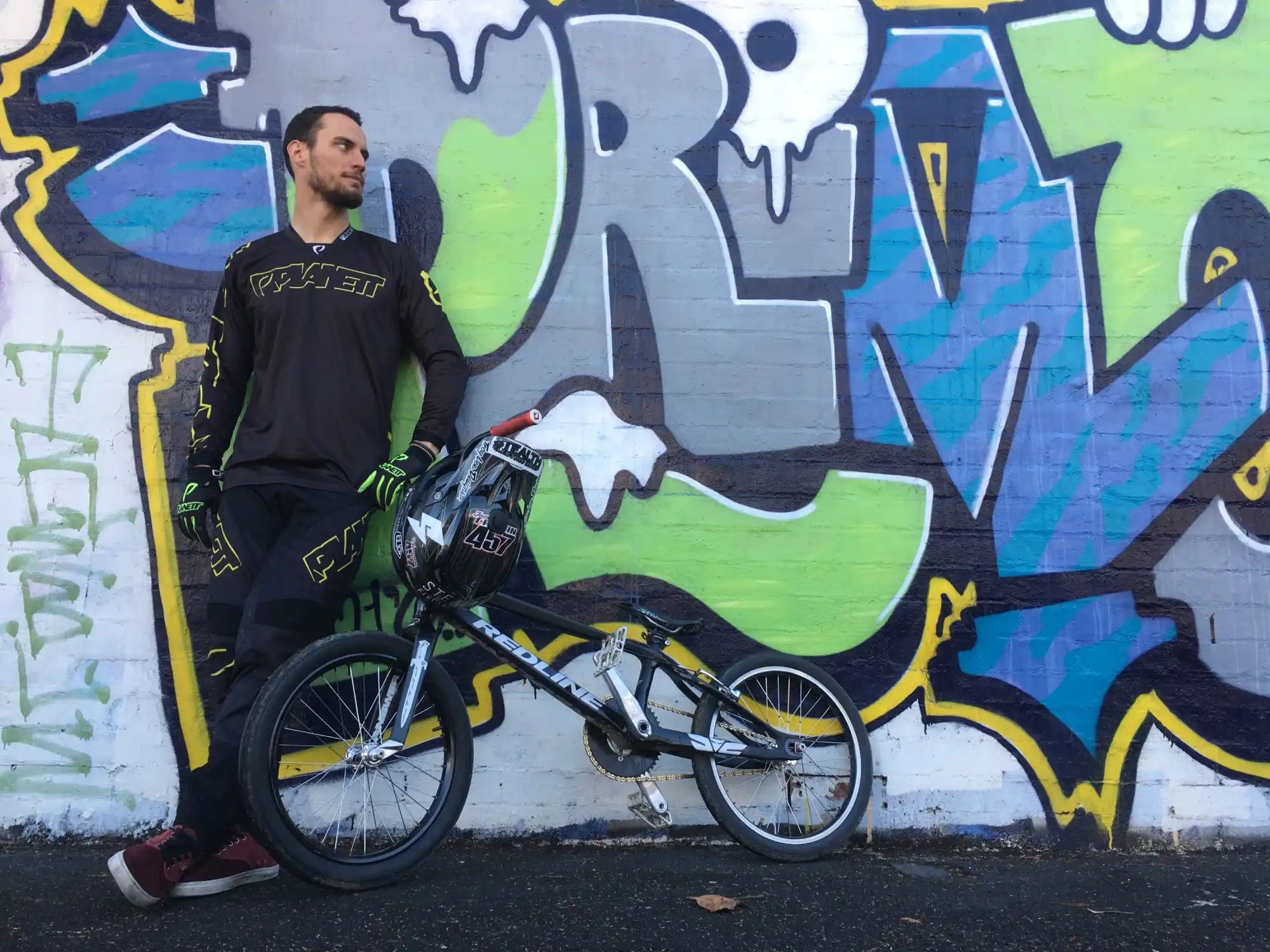 Black and yellow long-sleeved BMX racing jersey and pants with matching gloves.