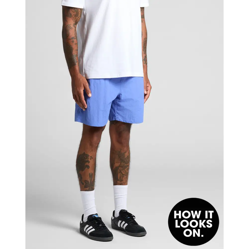 Man wearing blue shorts.
