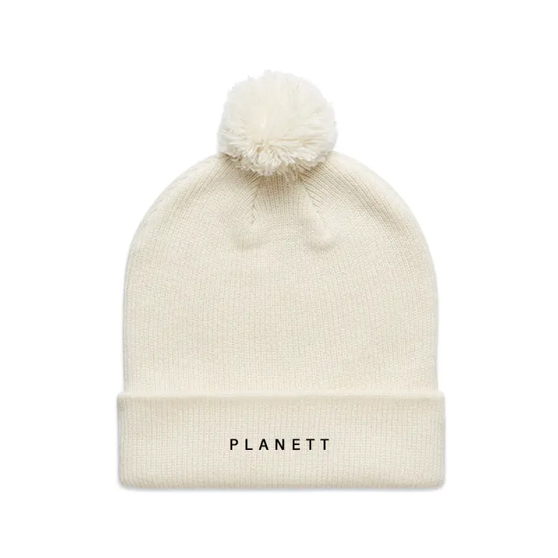 Off-white knit beanie with pompom.
