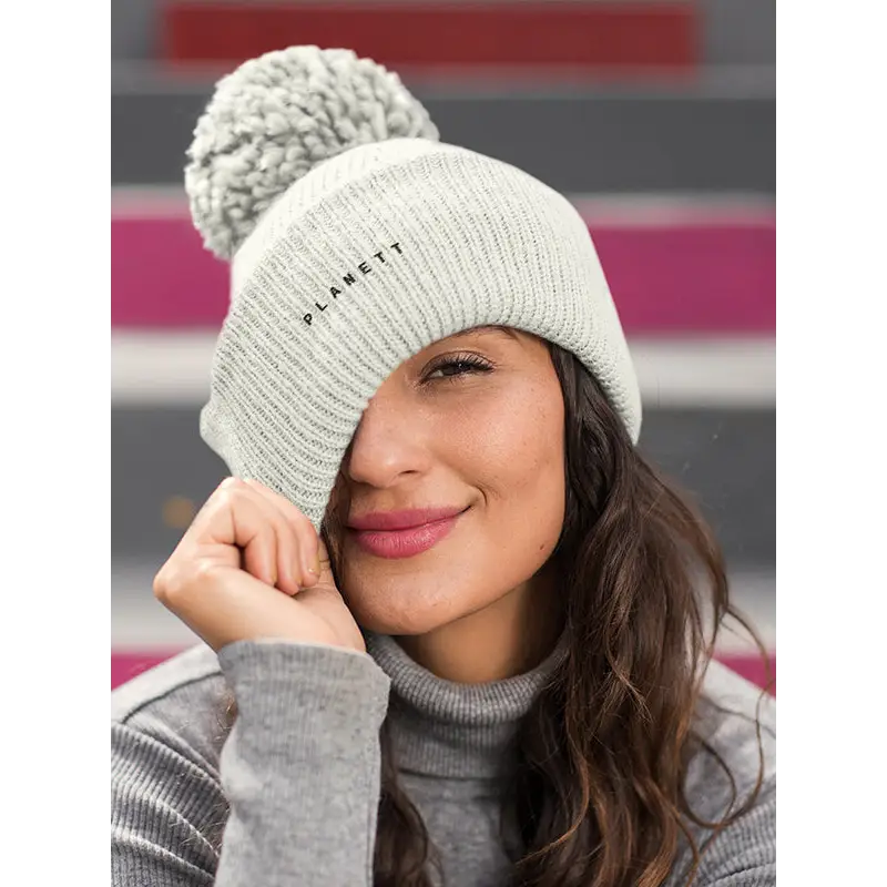 Gray knit beanie with pompom.