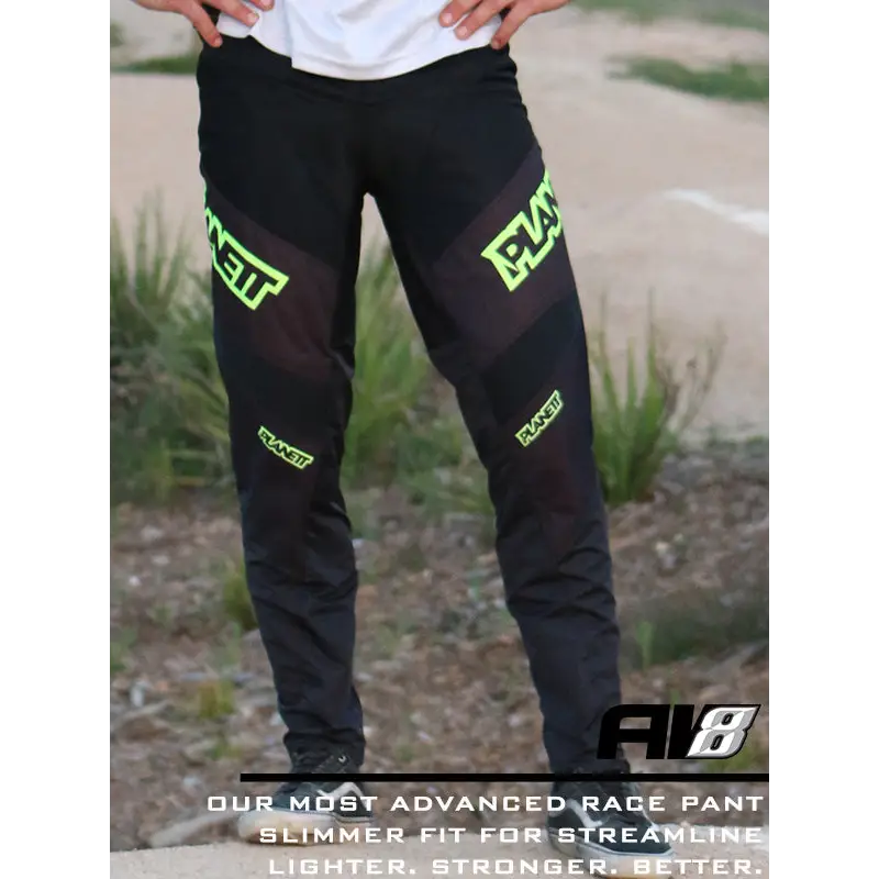 Black racing pants with neon green accents.