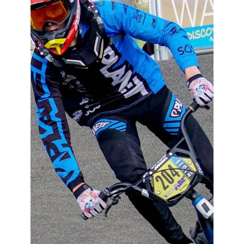 BMX racer in blue and black gear.