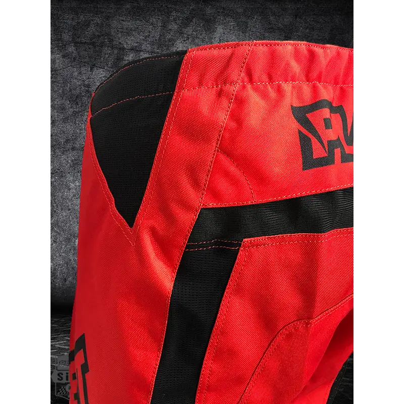 Red and black motocross pants.