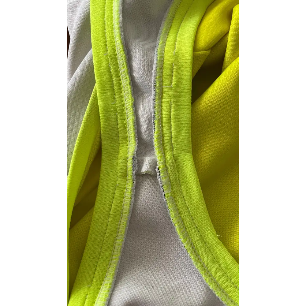 Neon yellow and white garment straps.