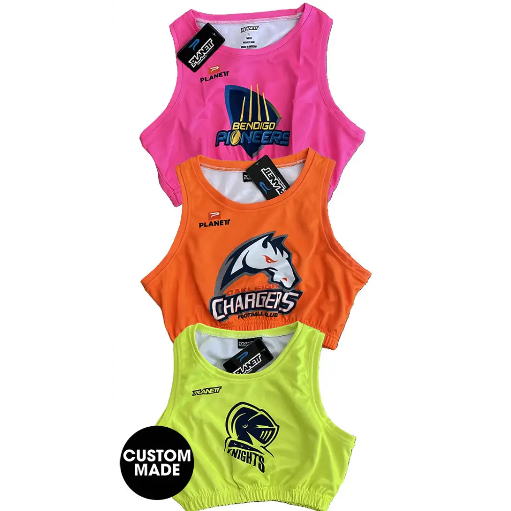 Stack of colorful sports tops.