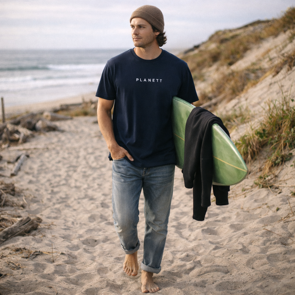 Navy blue ’planett’ t-shirt with a minimalist white logo across the chest