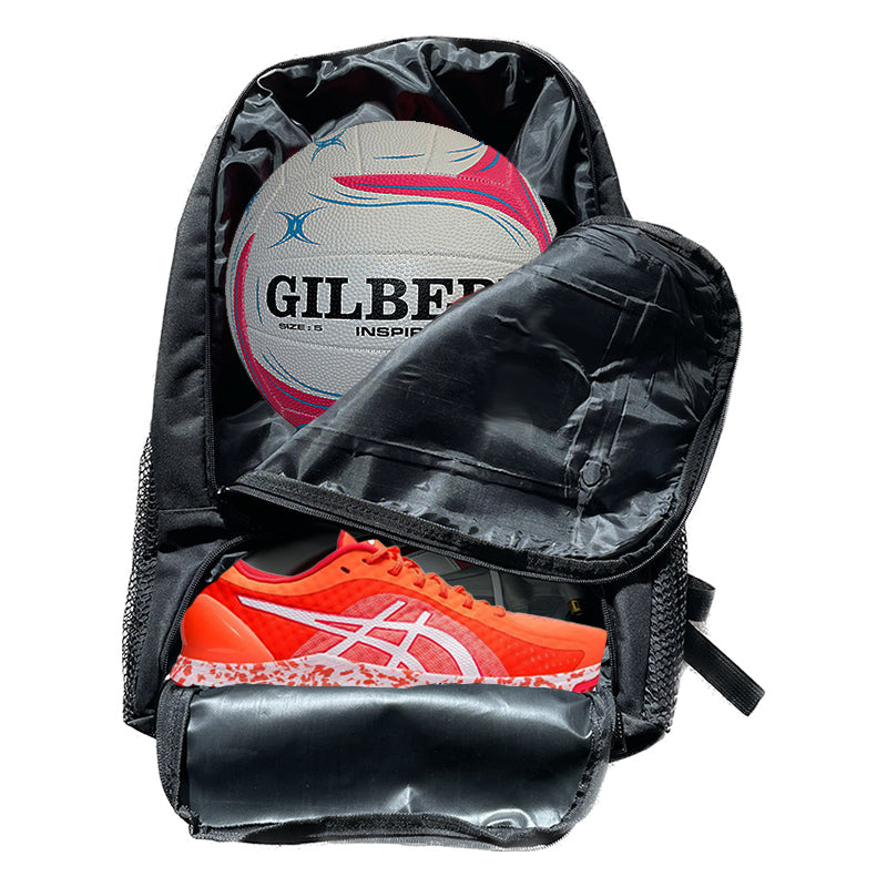 Black backpack containing a gilbert inspire rugby ball and an orange asics running shoe