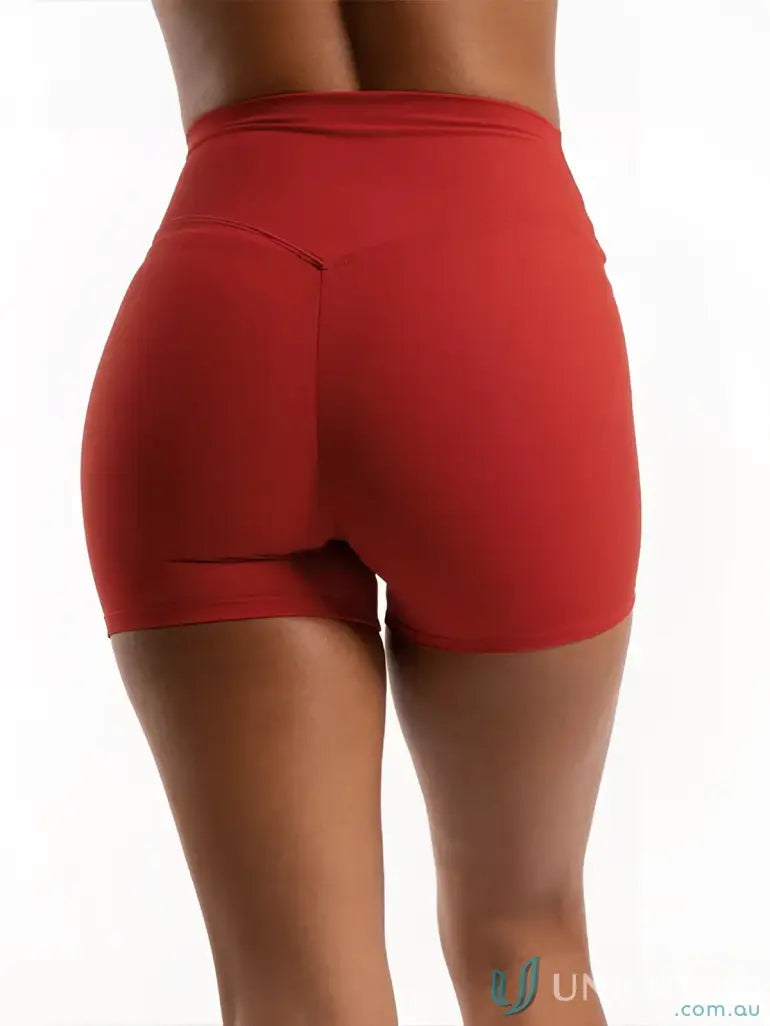 Red high-waisted shorts with a sleek design and stretchy material.
