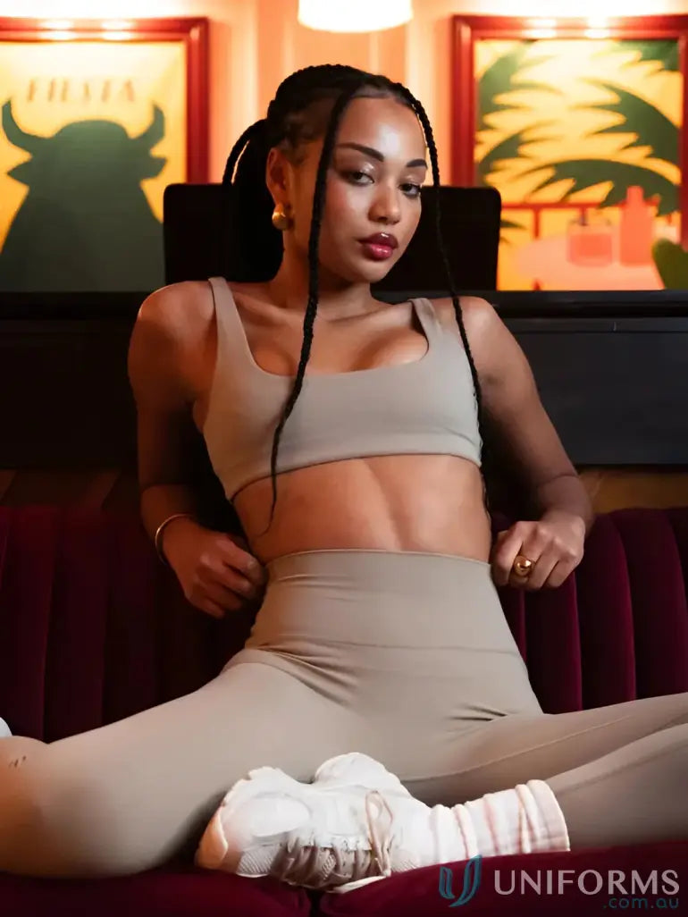 Beige and white athletic leggings with a ribbed texture.