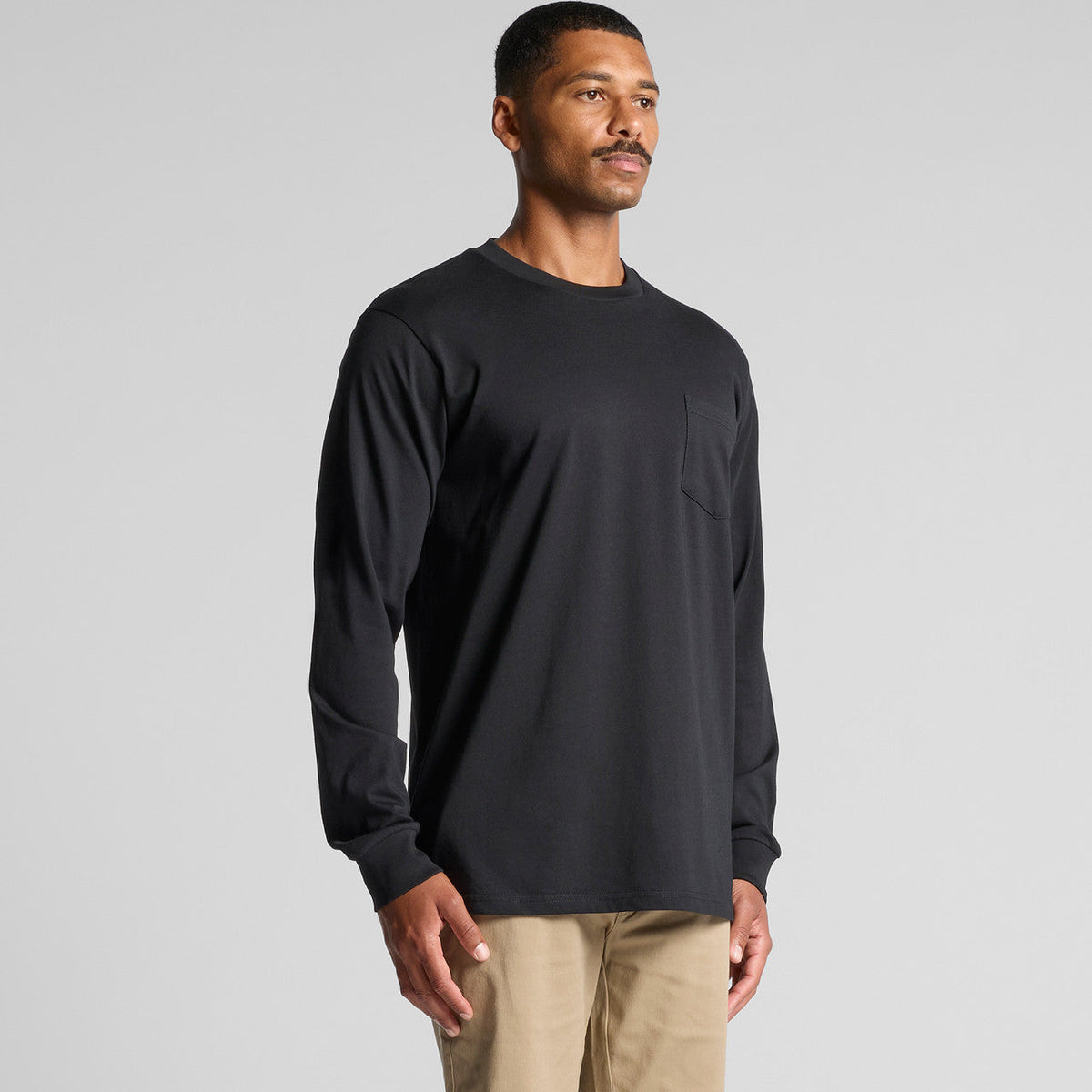 Charcoal gray long-sleeved t-shirt with pocket detail, made of soft cotton.