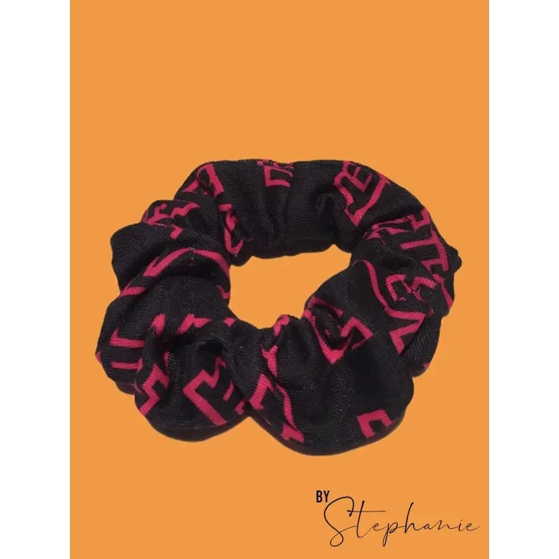 Black and pink patterned scrunchie.