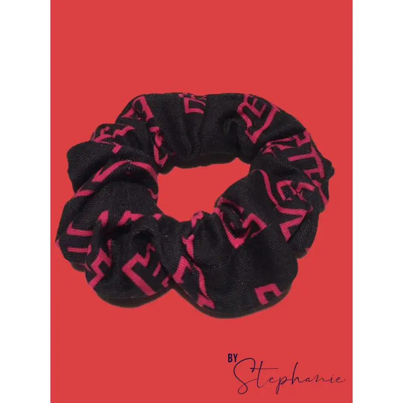 Black and pink patterned scrunchie.