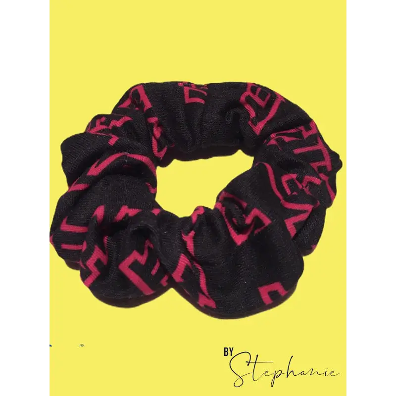 Black and pink patterned scrunchie.