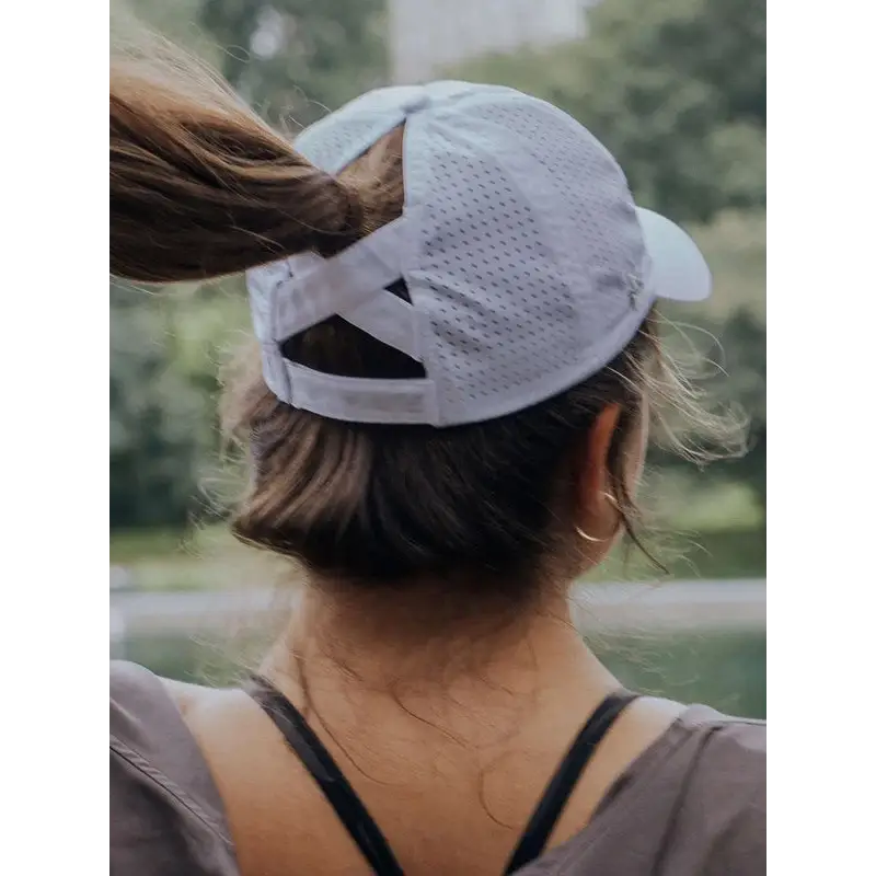 White ponytail baseball cap.