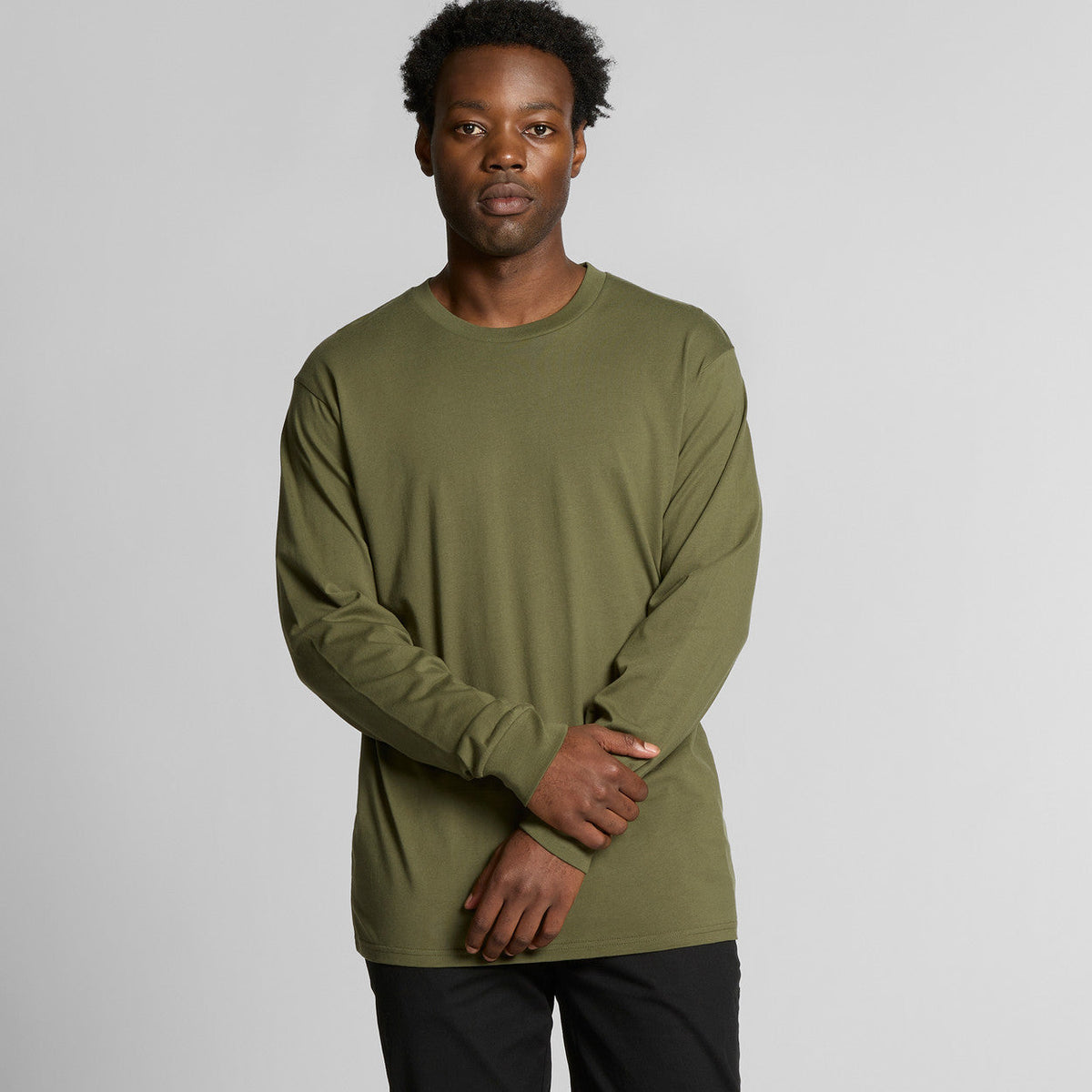 Olive green long-sleeve t-shirt with a relaxed fit and ribbed cuffs, made from soft cotton.