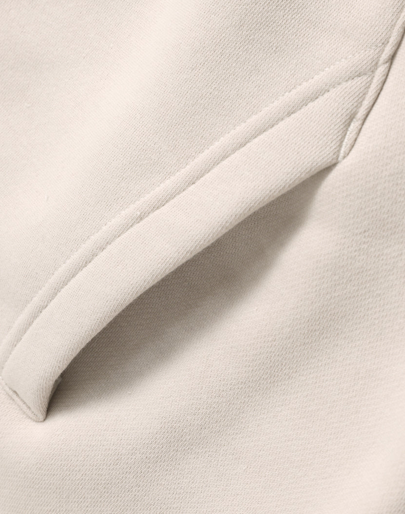Beige fabric pocket detail.