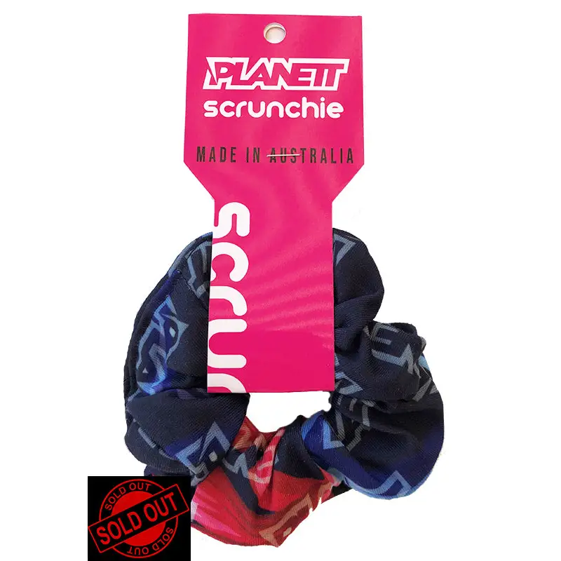 Patterned scrunchie with a pink tag.