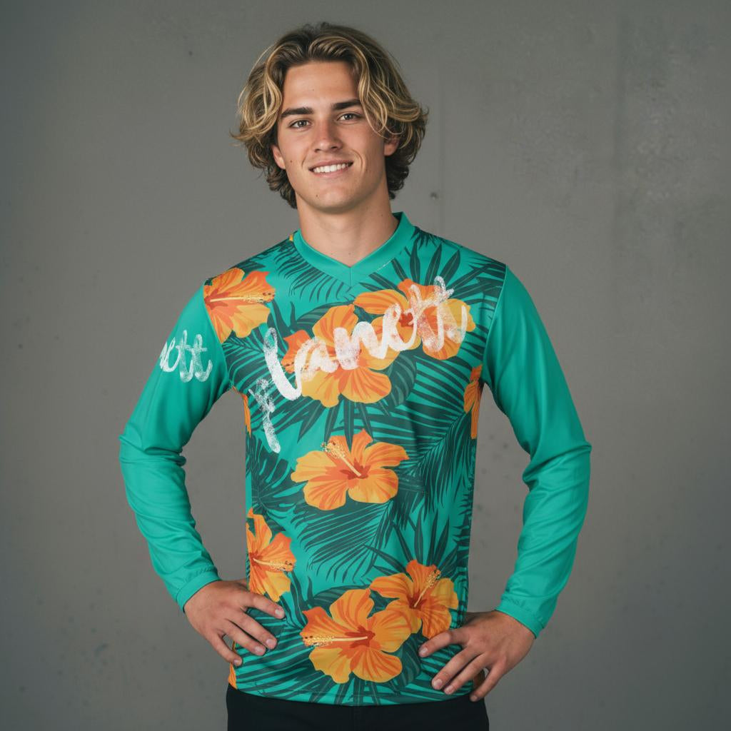 A long-sleeved jersey with a tropical floral and leaf pattern.