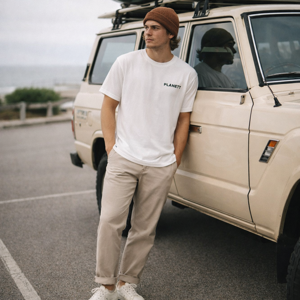 White cotton t-shirt with black ’planett’ logo on the chest