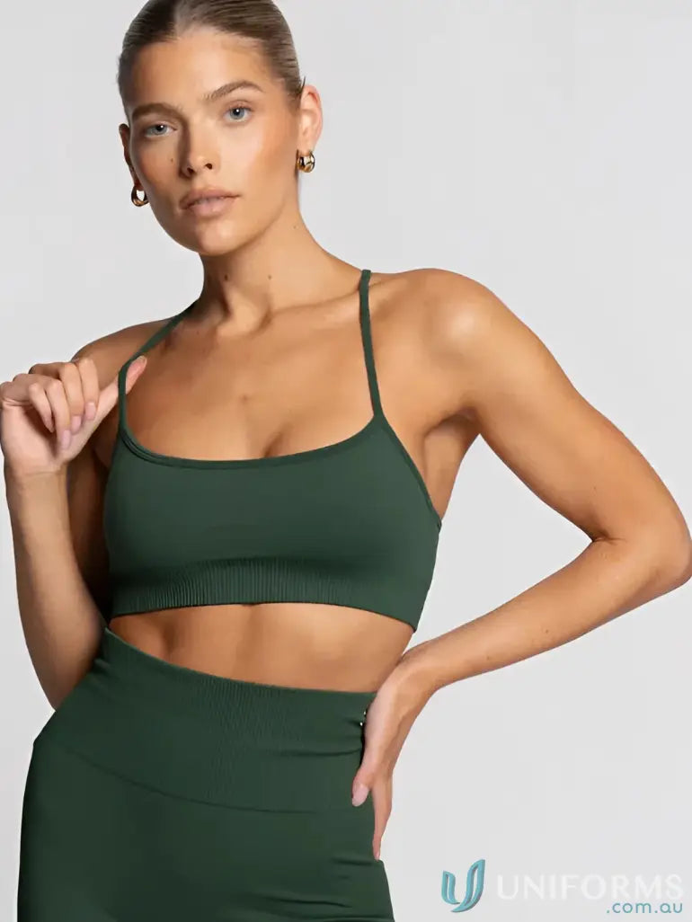 Green ribbed sports bra with thin straps and a scoop neckline.