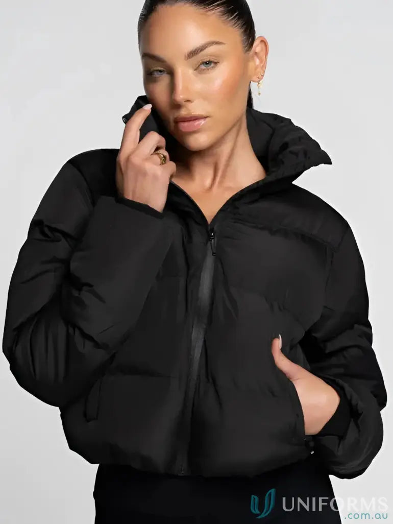 Black puffer jacket with quilted design and zipper closure.