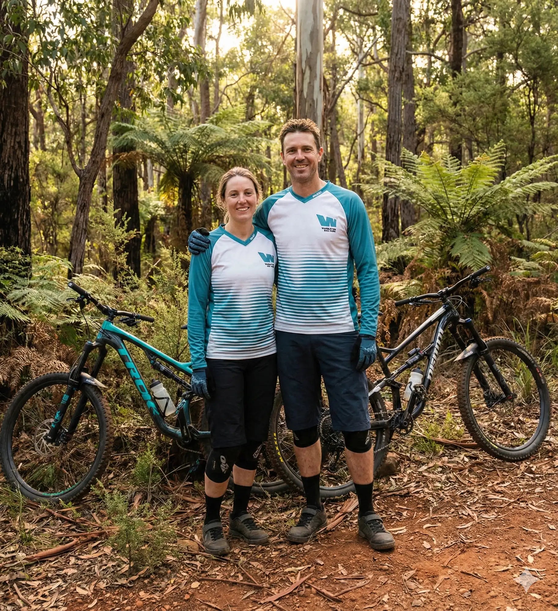 A teal and white gradient long-sleeved mountain biking jersey with a v-shaped neckline, featuring the ’w’ logo on the chest.
