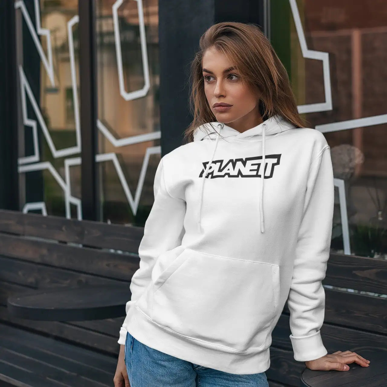 White hoodie with black ’planet’ graphic across the chest