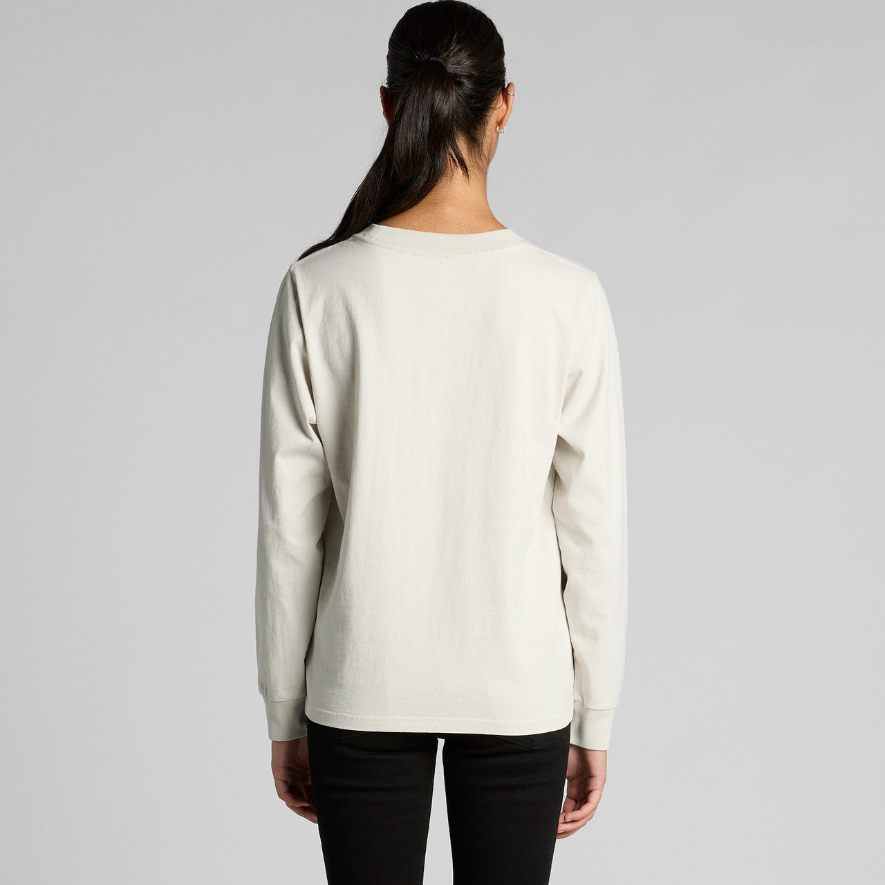 Cream-colored long-sleeved sweatshirt with ribbed cuffs and hem, likely made of cotton or polyester blend.