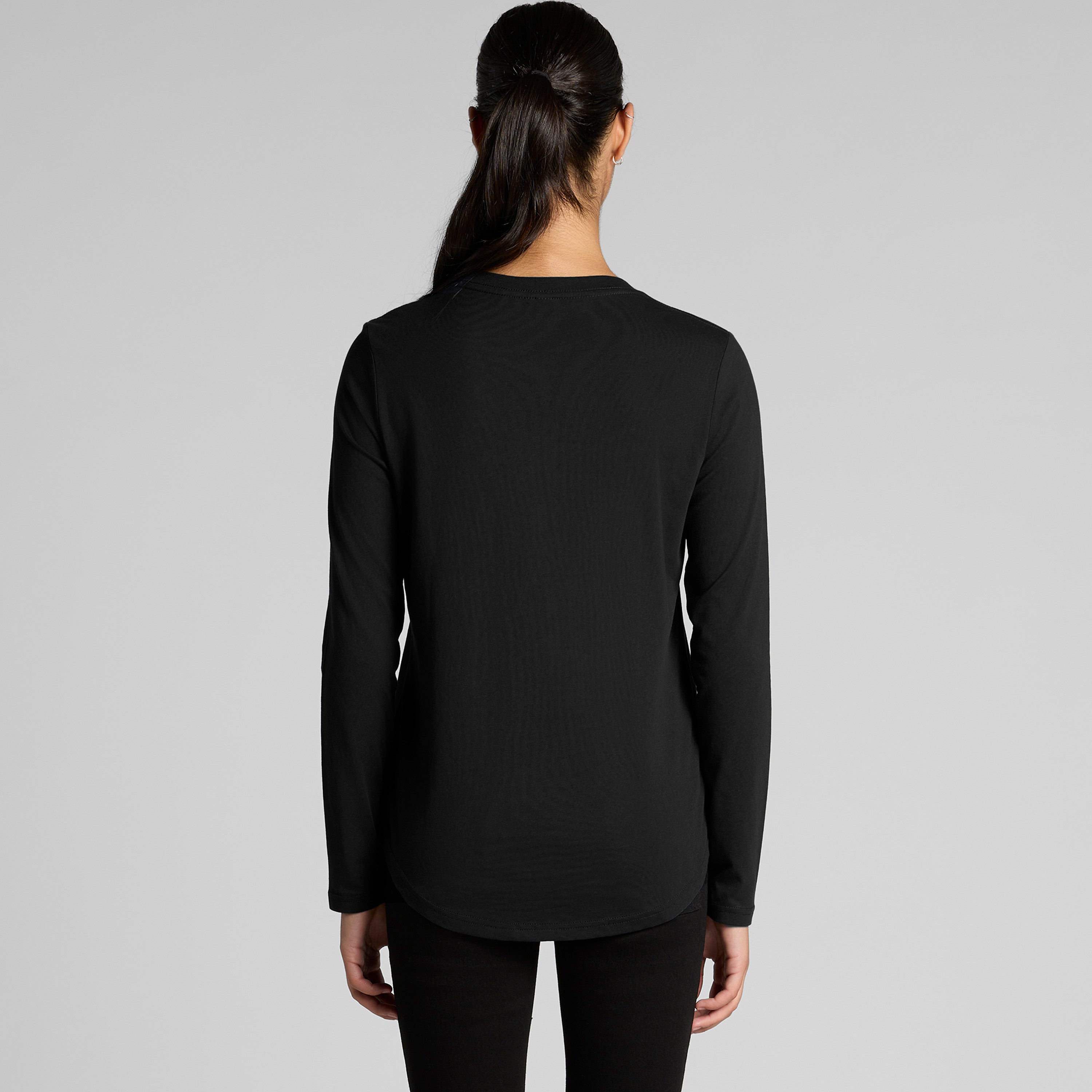 Black long-sleeved tunic top with a relaxed fit and rounded neckline.