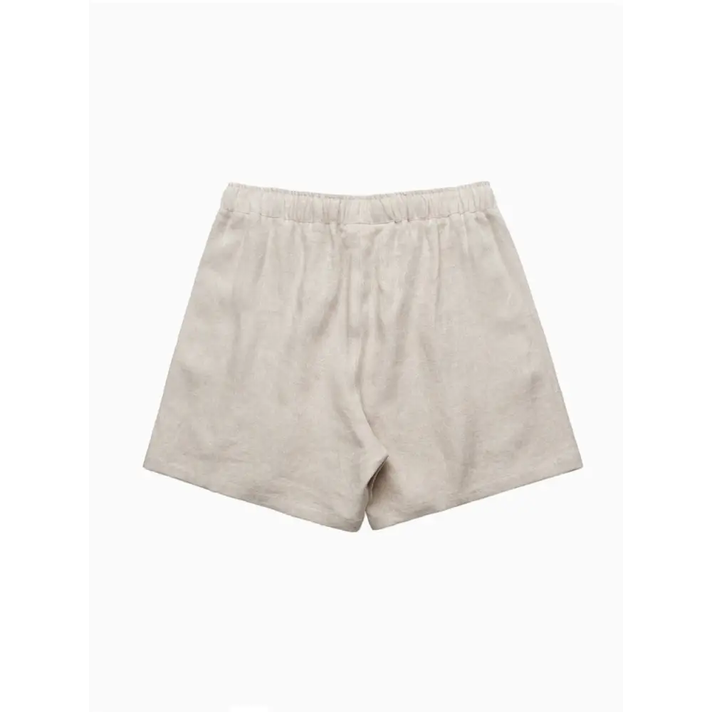 Beige elastic-waist shorts.