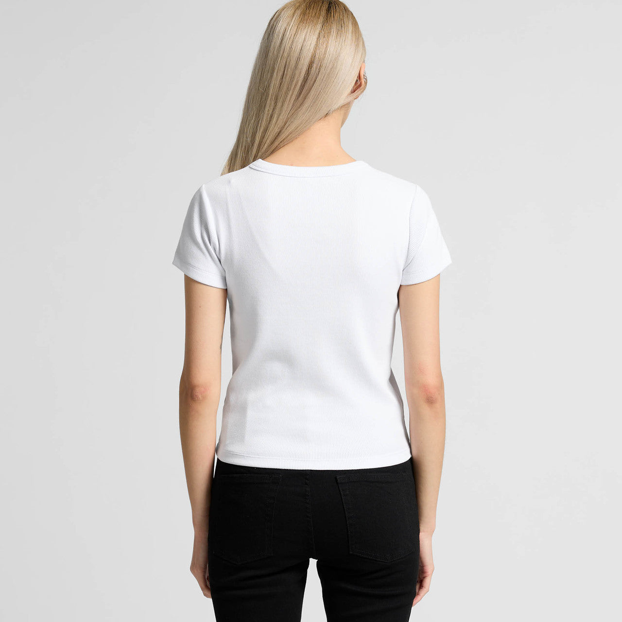 White short-sleeved t-shirt with a crew neck and black pants.