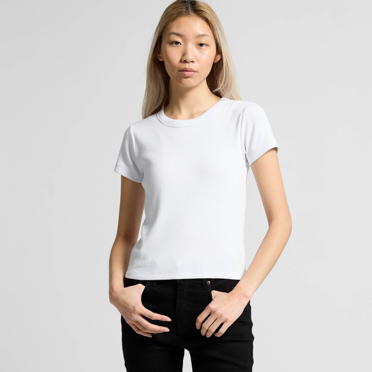 White crew neck t-shirt with short sleeves and black pants.
