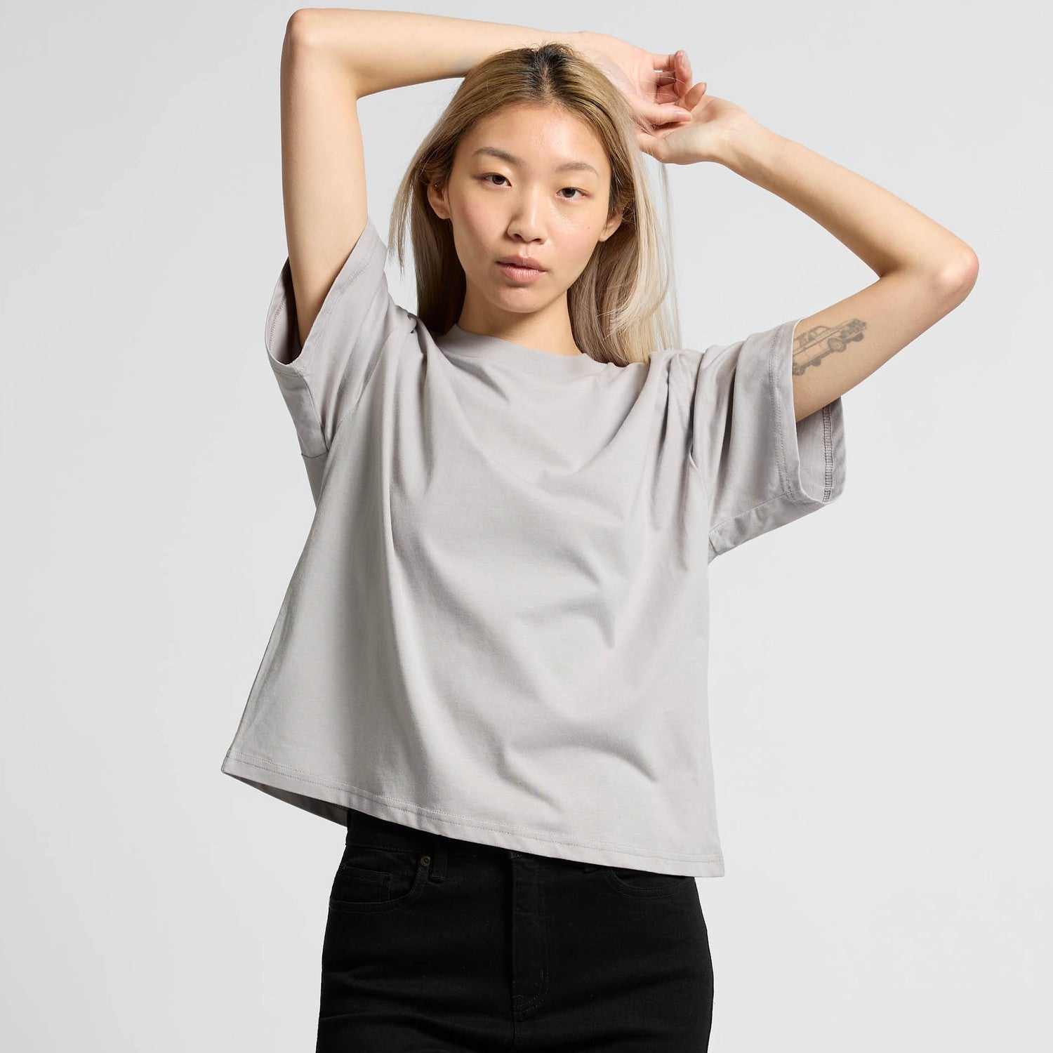 Light gray oversized t-shirt with short sleeves and a relaxed fit.