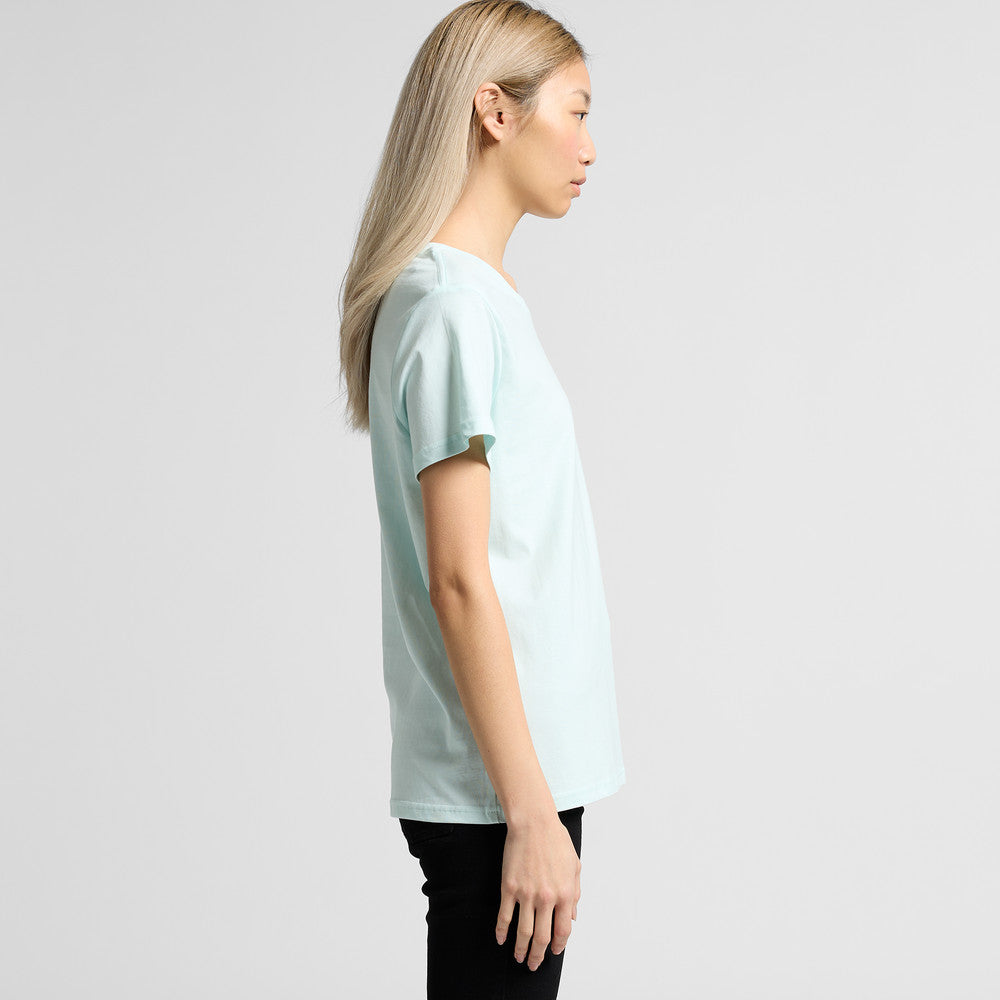 Light blue oversized t-shirt with black pants and long blonde hair.