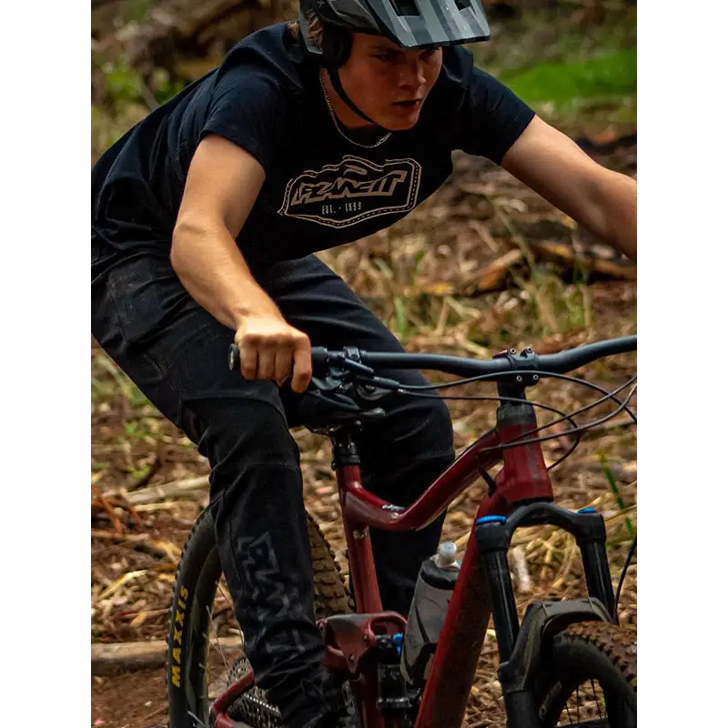 Mountain biker on a red bike.
