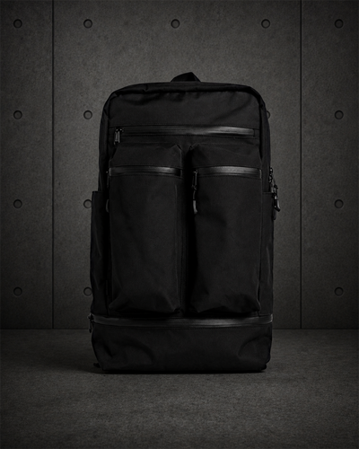 Recycled Travel Backpack 1030 blank product on dark industrial concrete background