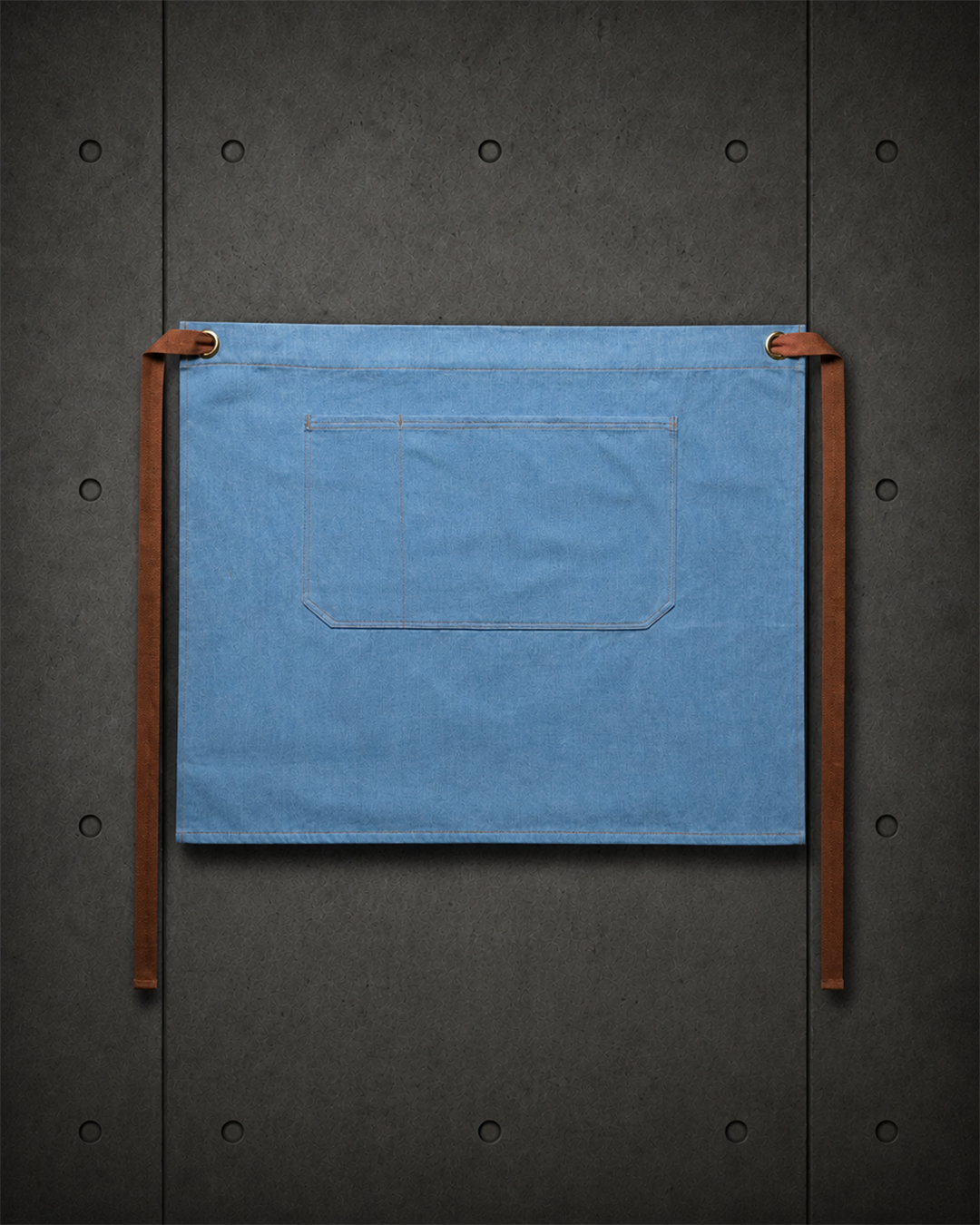 Denim Half Apron 1085 blank product on dark industrial concrete background