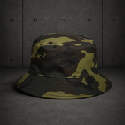 Camo Bucket Hat 1117C blank product on dark industrial concrete background