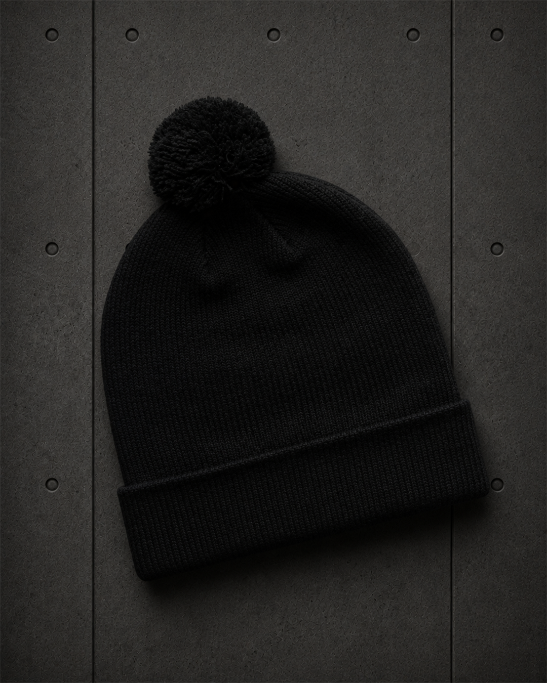 Pom Pom Beanie 1124 blank product on dark industrial concrete background