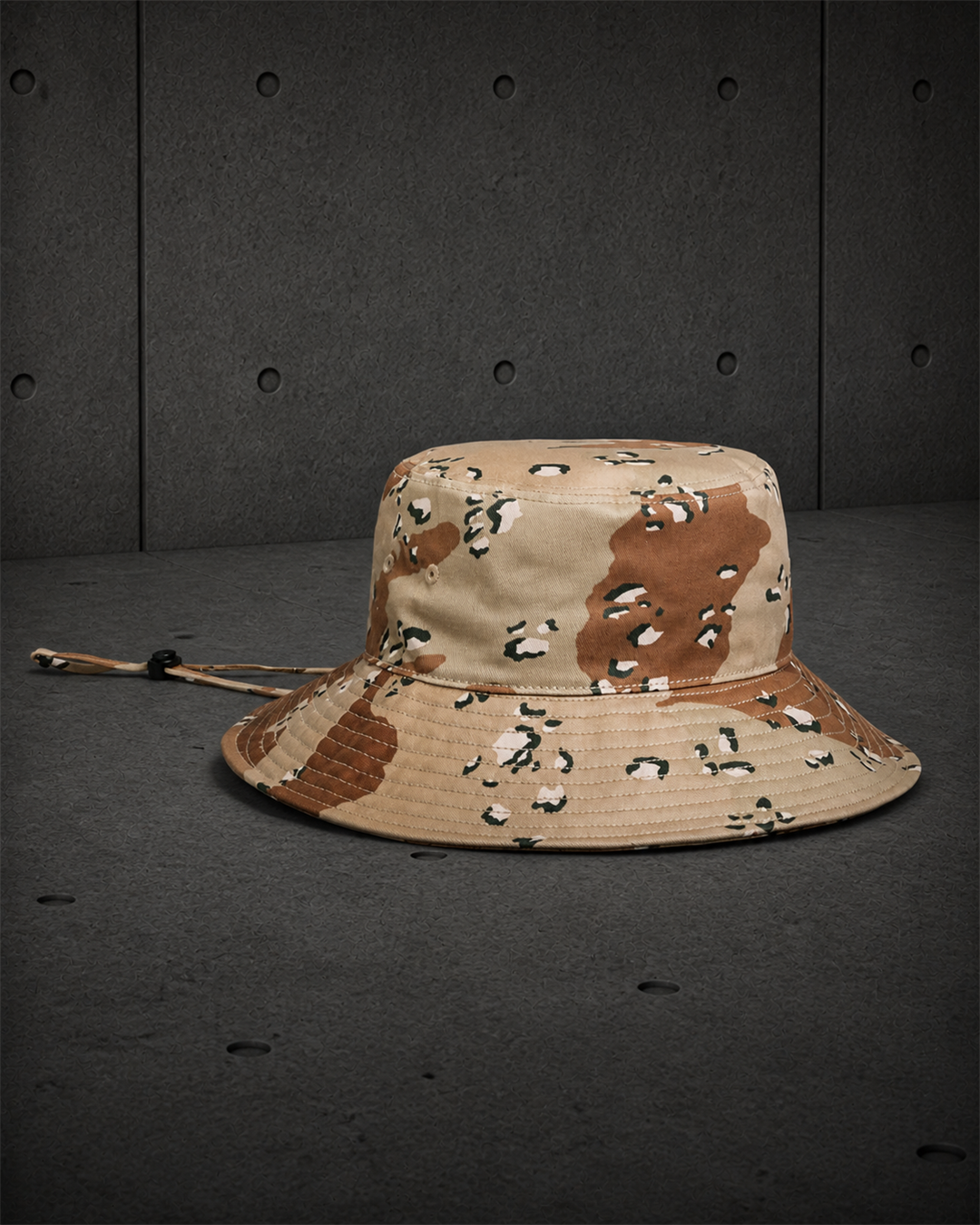 Wide Brim Camo Bucket Hat 1172C blank product on dark industrial concrete background