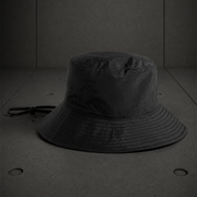 Nylon Wide Brim Bucket Hat 1174 blank product on dark industrial concrete background