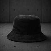 Terry Bucket Hat 1175 blank product on dark industrial concrete background