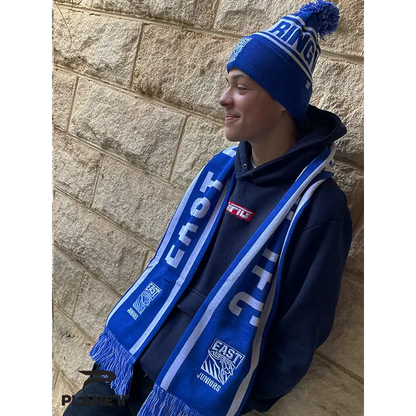 Blue and white knit scarf.
